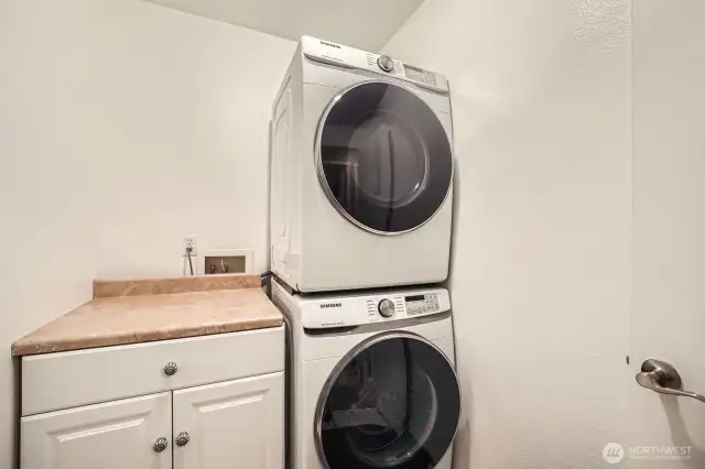 Laundry room stacked Samsung washer and dryer from Albert appliances locally sourced 2021