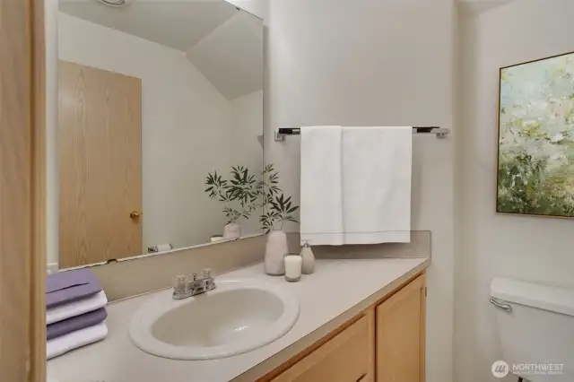 Convenient powder room on main level. This photo has been virtually staged.