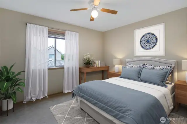 One of two good sized bedrooms with ceiling fans to keep the air circulated. This photo has been virtually staged.