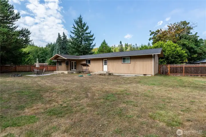 Enjoy summer evenings on the covered patio just off the French doors, perfect for outdoor dining or entertaining.