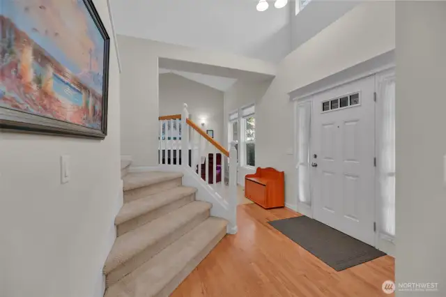 Front entry with high ceilings and grand staircase greets you and your guests. Real Oak hardwoods and front entry closet.