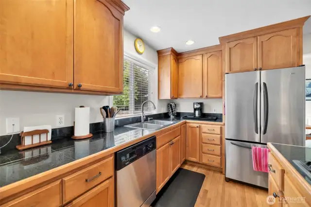 All appliances stay including dishwasher, side by side fridge with freezer drawer, high ceilings, oak hardwoods and tons of cabinet space.
