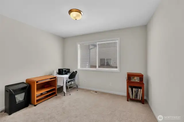 Dedicated office space with glass french doors located on the main level. Window faces south and fills the space with tons of light. New carpet just installed. Wood blinds cover the window for additional privacy.