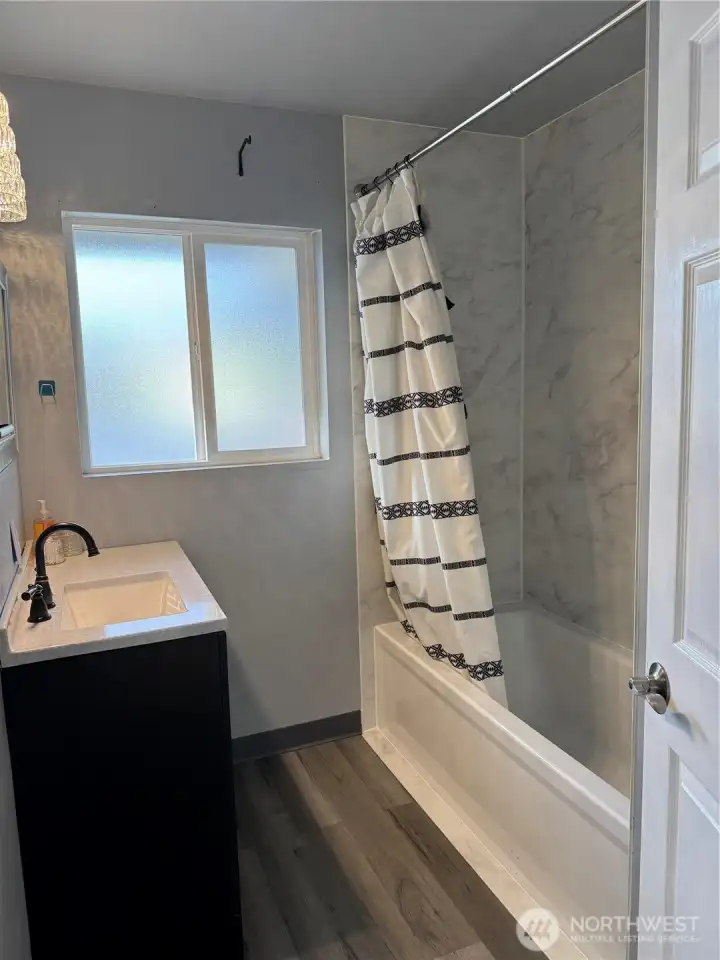 Bathroom, newer tub shower and sink