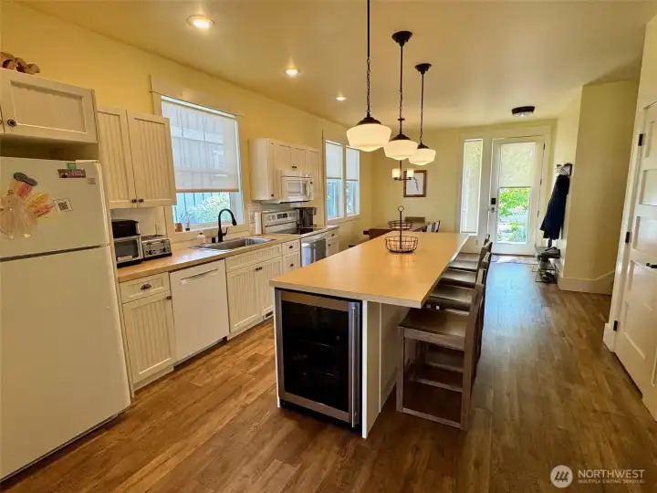 Island Kitchen has extended counters for an Eating bar.   Plus a wine fridge.