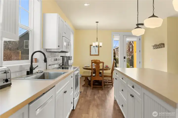 Abundant Cabinets in Center island, and Kitchen offers 2 Pantrys!  Lots of Storage space!