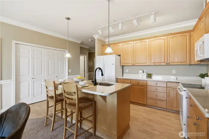 Another angle of the kitchen, with doors to the laundry area.