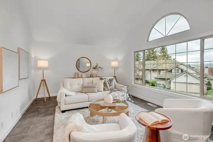 Vaulted ceilings, walls of windows....custom tile flooring and freshly painted. The living room is a room you are sure to love!