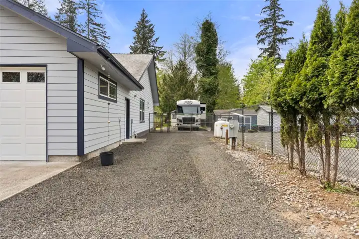 The home has a fenced RV parking area with 50 amp power, water hookup and dump station.