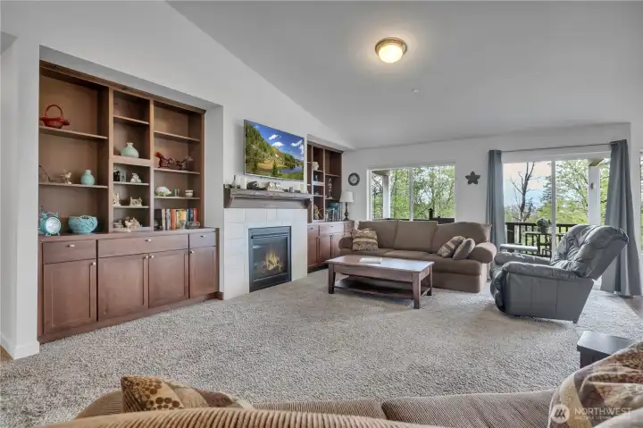 Inviting fireplace surrounded by stylish built-ins that add charm and functional storage