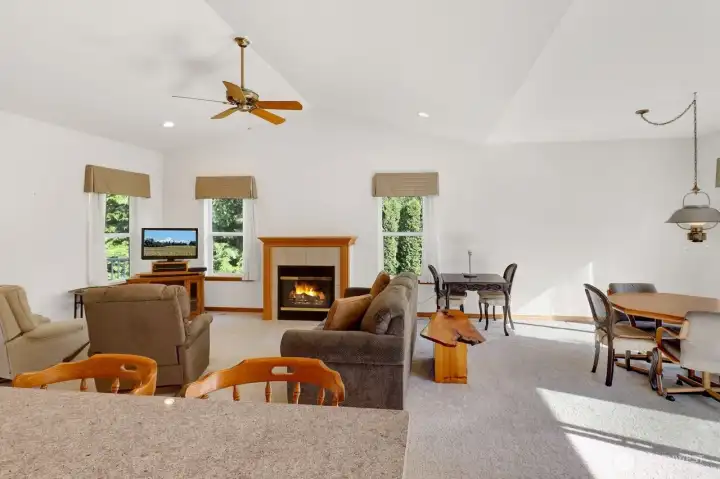 Living room open to dining and kitchen.