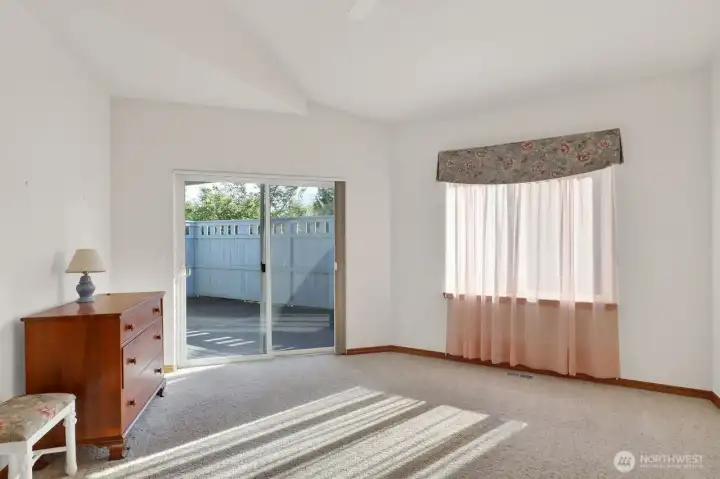 Primary bedroom with slider to private deck.