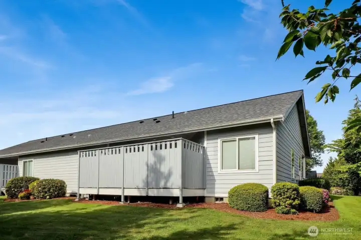 Backyard and view of enclosed deck.