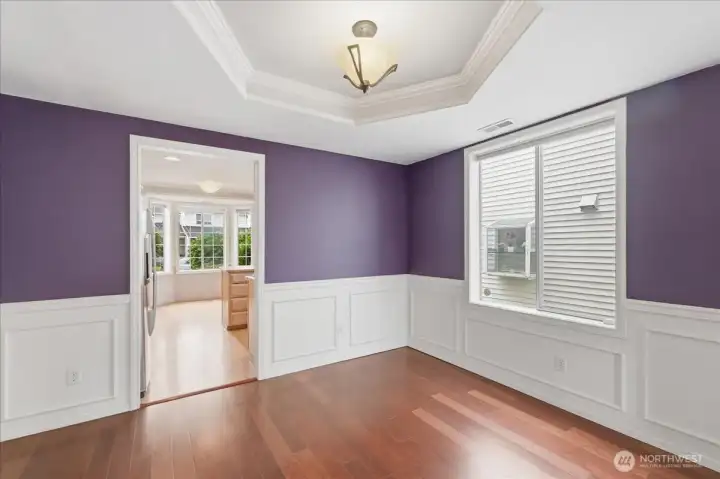 Opposite view of the dining room with wainscotting, shadow boxing and chair rail.