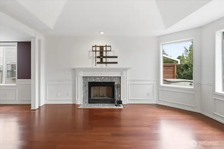 Living room fireplace with dining room to the left.