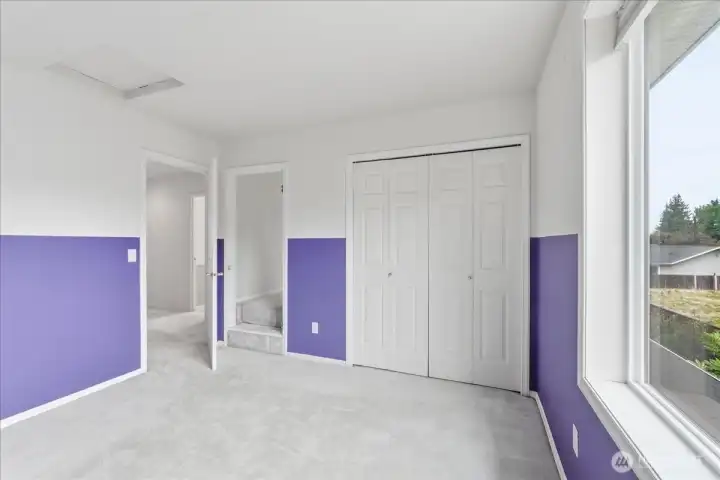 2nd bedroom showing entry to "secret" room - use as a play room, storage, office - you decide.