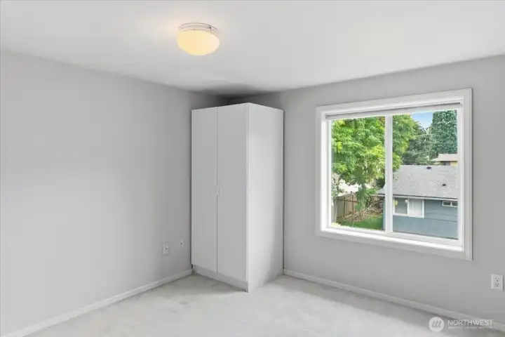 "Secret" room with window, a couple of cabinets and bookcases.
