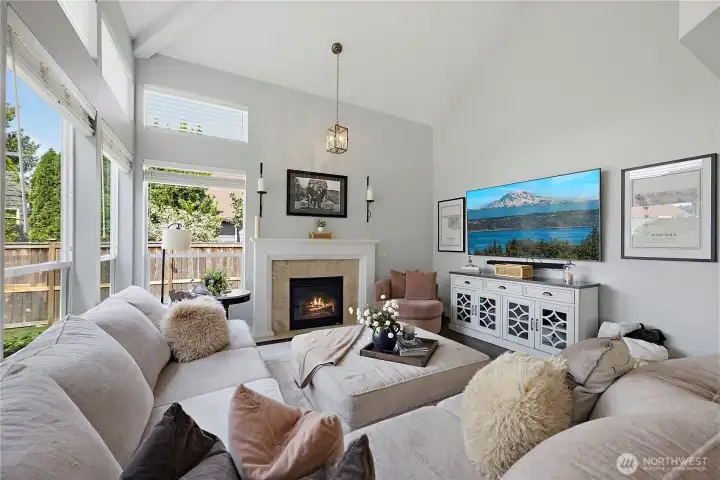Bold bright windows and a cozy gas fireplace