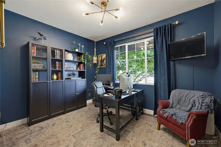 4th bedroom in the front of the home, currently an office. Closet upgraded as an extended work space.