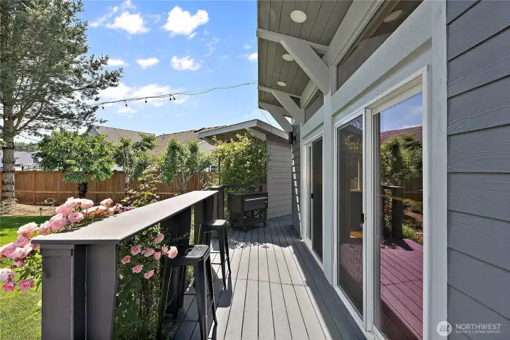 Complete with a deck and bar tops, climbing with clematis vines and roses