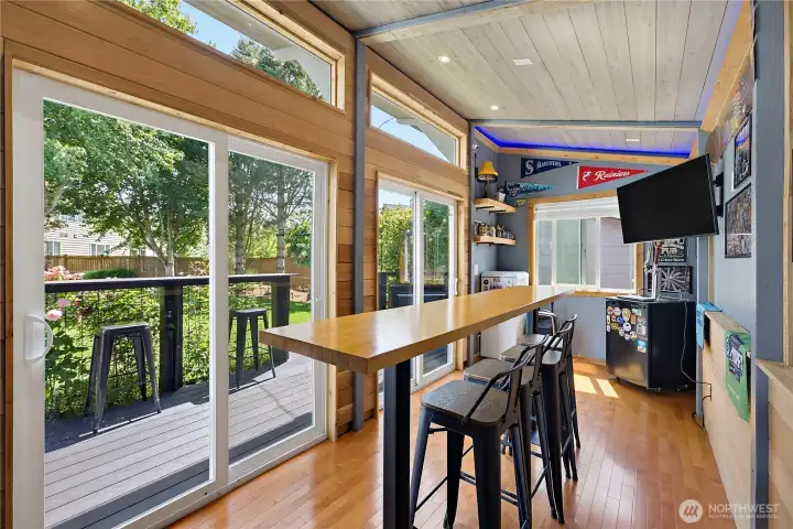 Party room with bar seating, 2 TVS, and ready for more fun!