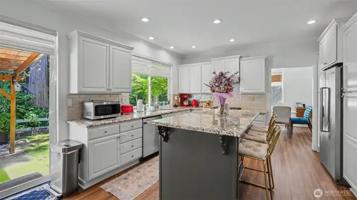 The spacious kitchen features granite countertops and upgraded appliances.