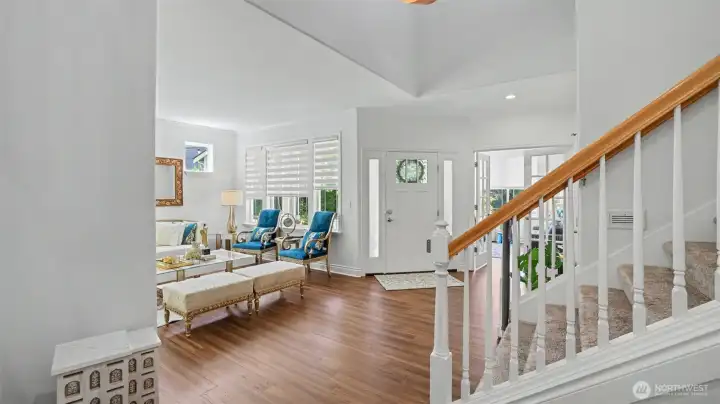 Step through the front door into a dramatic two-story foyer filled with natural light and an immediate sense of openness.