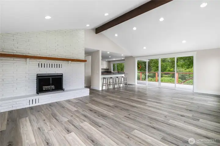 Welcome to your spacious and bright open concept kitchen/living/dining with propane fireplace