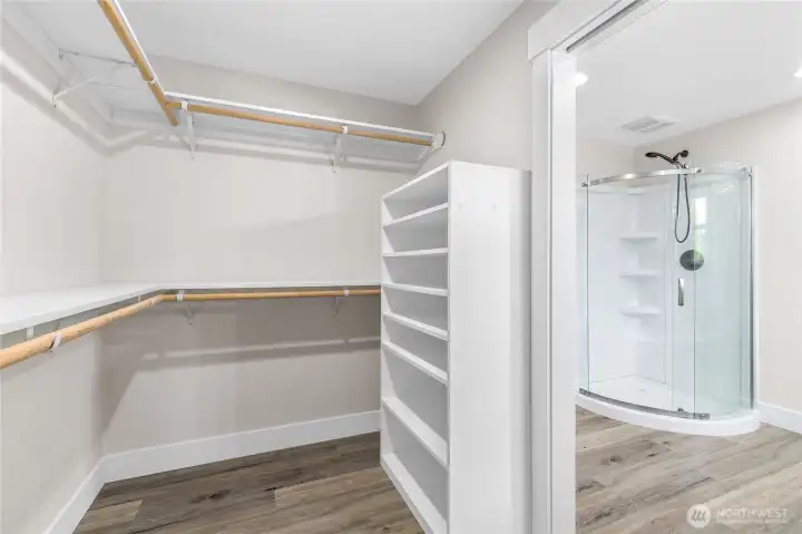 Primary walk-in closet with custom shelving