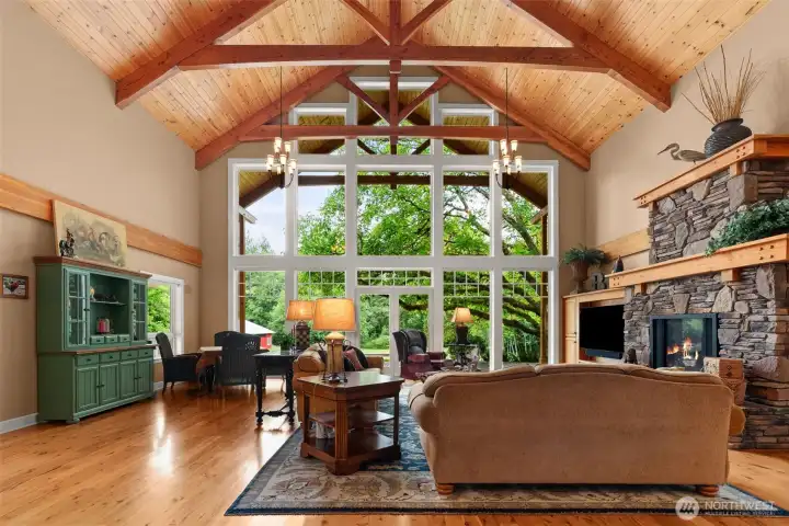 Walk into Soaring Vaulted Ceiling featuring solid wood beams and pine ceiling