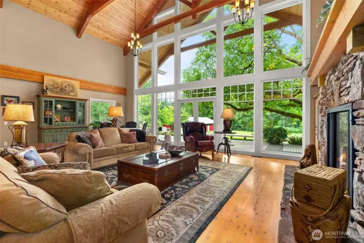 Spacious Living Room with massive window wall to take in your incredible acreage