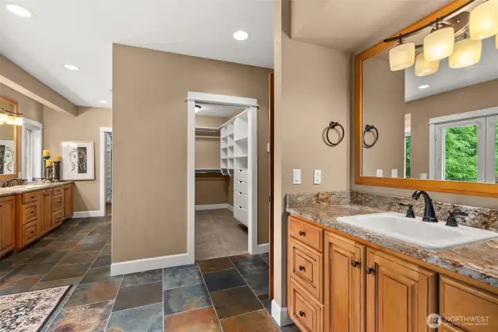 Primary En-suite with dual vanities and two walk-in closets