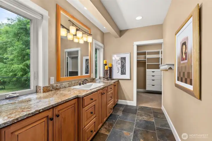 Primary En-suite with heated slate floors and territorial backyard views
