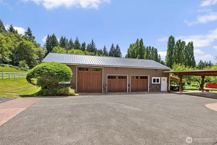 Main home garage is heated with over sized RV bay with plenty of storage