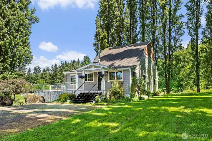 The original farmhouse, now a guest home is approx 1725 sq ft, features 2 beds, a den, kitchen, dining room, 1.17 bath, laundry room and oversized Trex deck all packed with charm