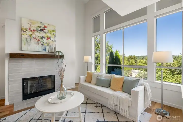 Gas fireplace, and tile surround with sweeping views of Cascade mountains.