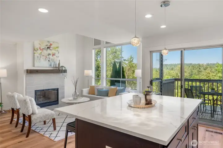Large island with storage on both sides, Living room and deck with views of Cascade mountains.
