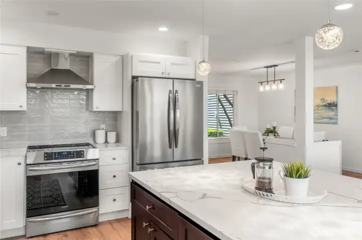 Stainless appliances and abundant storage creates an organized kitchen layout