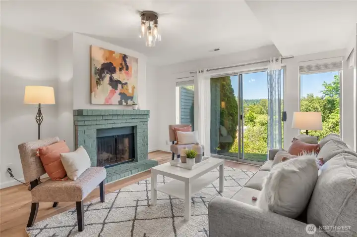 Wood burning fireplace in sitting area.