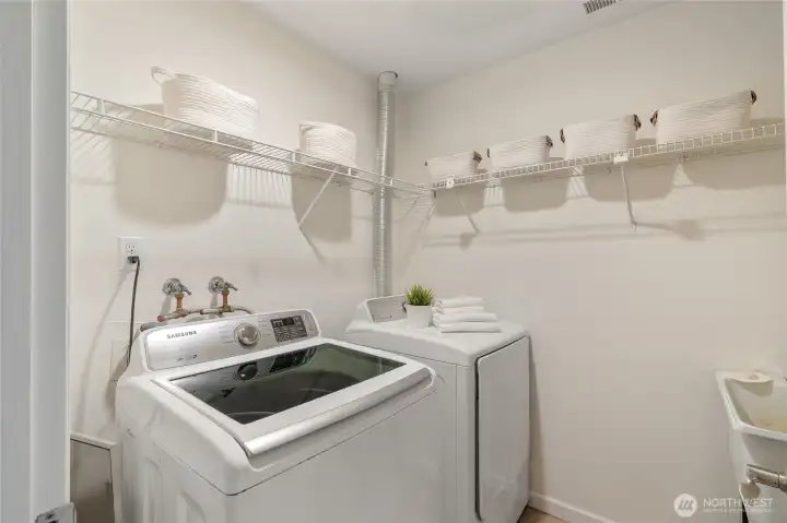 Laundry is located on the lower level and has extra space for all things laundry and storage.