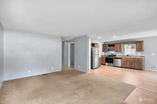 Living room with open kitchen.