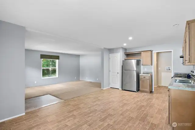 Open concept dinning, kitchen and living area.