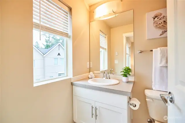 The bathroom off this bedroom has a full tub.