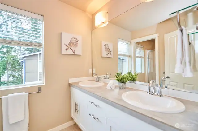 The bathroom off bedroom #2 features a large shower stall.