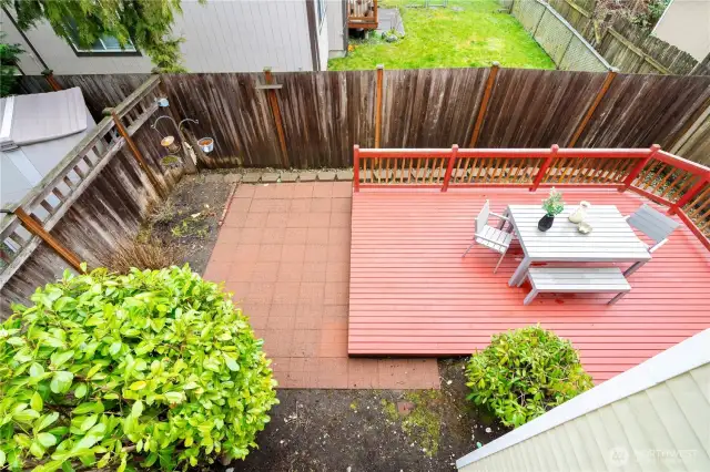 Huge backyard with concrete and deck!