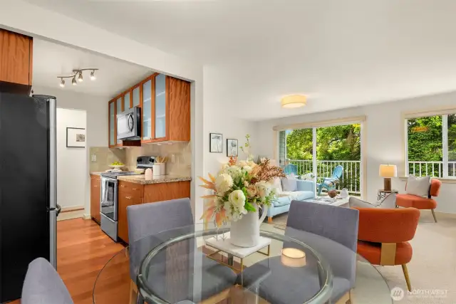Open dining room with cherry hardwood floors.