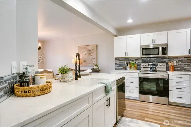 Peninsula optimizes storage while keeping the space open. While prepping food, and washing dishes, you overlook your living space and backyard.