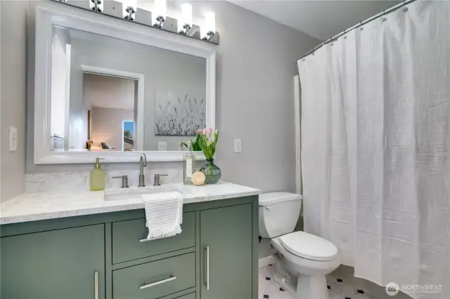 Primary bathroom with an extra large vanity and all new fixtures.