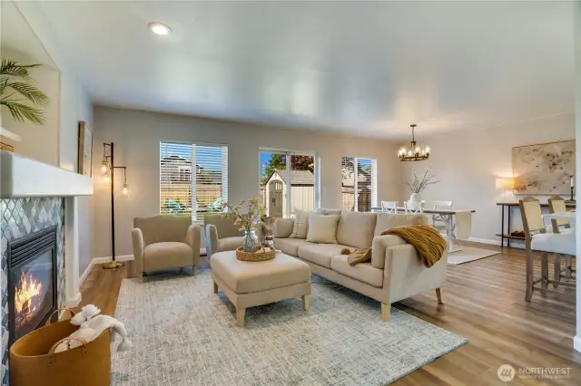 Wide open living, dining and kitchen. luxury Vinyl Plank flooring, fresh paint with consistent texture, tasteful lighting and central fireplace for our fall and winter months.