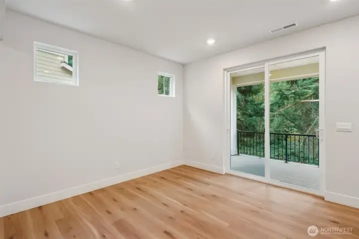 Nook area and slider to large, covered deck.  Very private lot and peek a boo view of the water.
